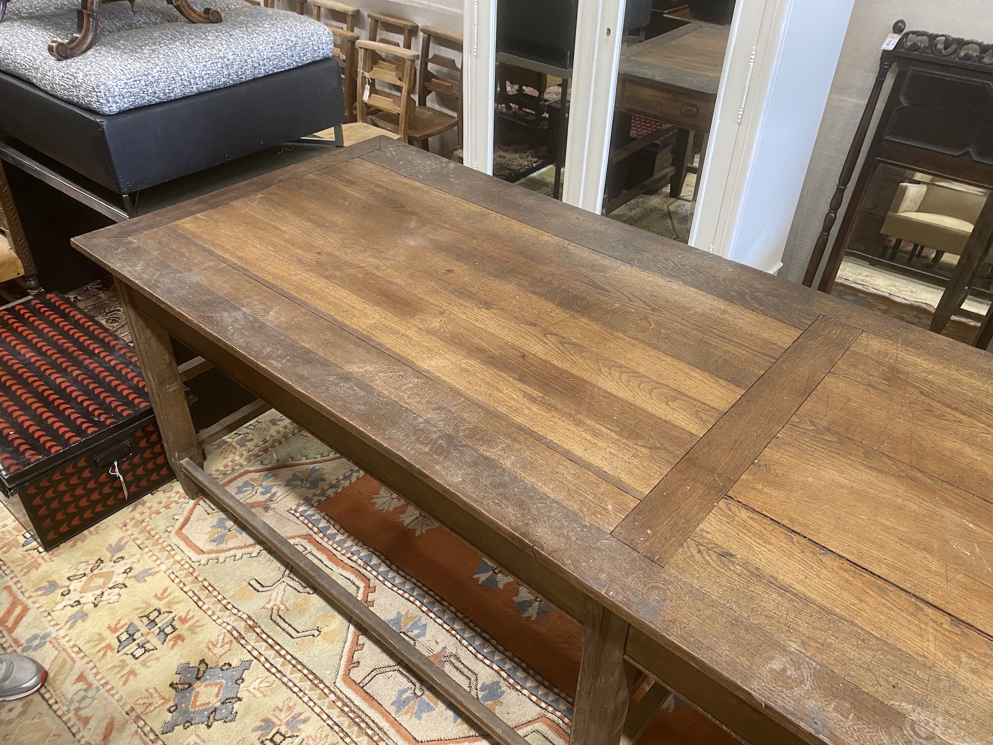 A 19th century French oak serving table, length 300cm, depth 100cm, height 85cm